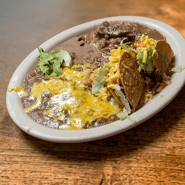 Carne Guisada Supreme Platter.